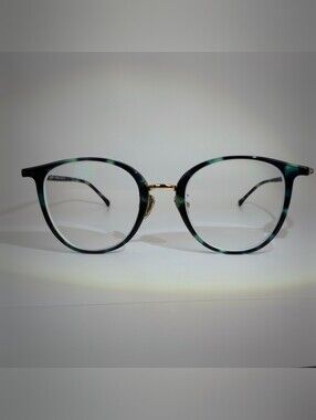 Aloft. Round women's Eyeglasses in Green Tortoiseshell with Gold Bridge.